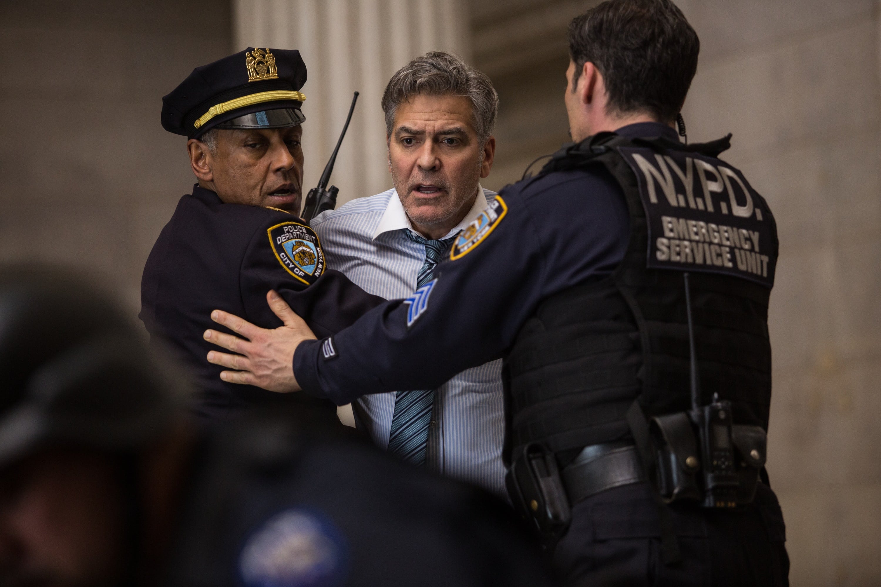 George Clooney (Lee Gates, center) stars with Giancarlo Esposito (Captain Marcus Powell, left) in TriStar Pictures' MONEY MONSTER.