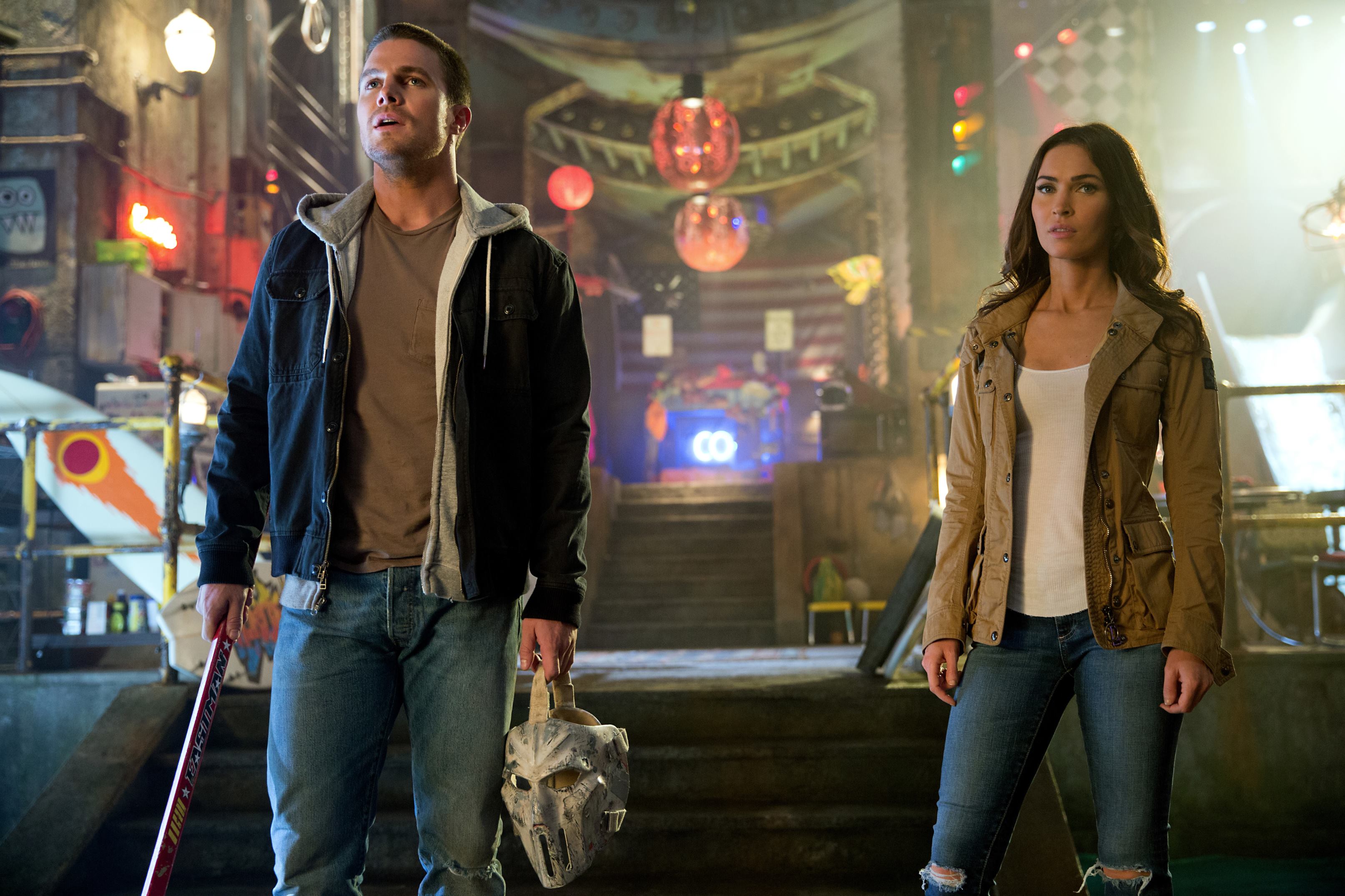 Left to right: Stephen Amell as Casey Jones and Megan Fox as April O'Neil in Teenage Mutant Ninja Turtles: Out of the Shadows from Paramount Pictures, Nickelodeon Movies and Platinum Dunes