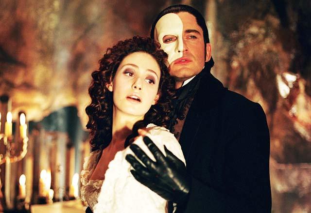 The Phantom of the Opera (2004) Directed by Joel Schumacher Shown: Emmy Rossum (as Christine), Gerard Butler (as The Phantom)